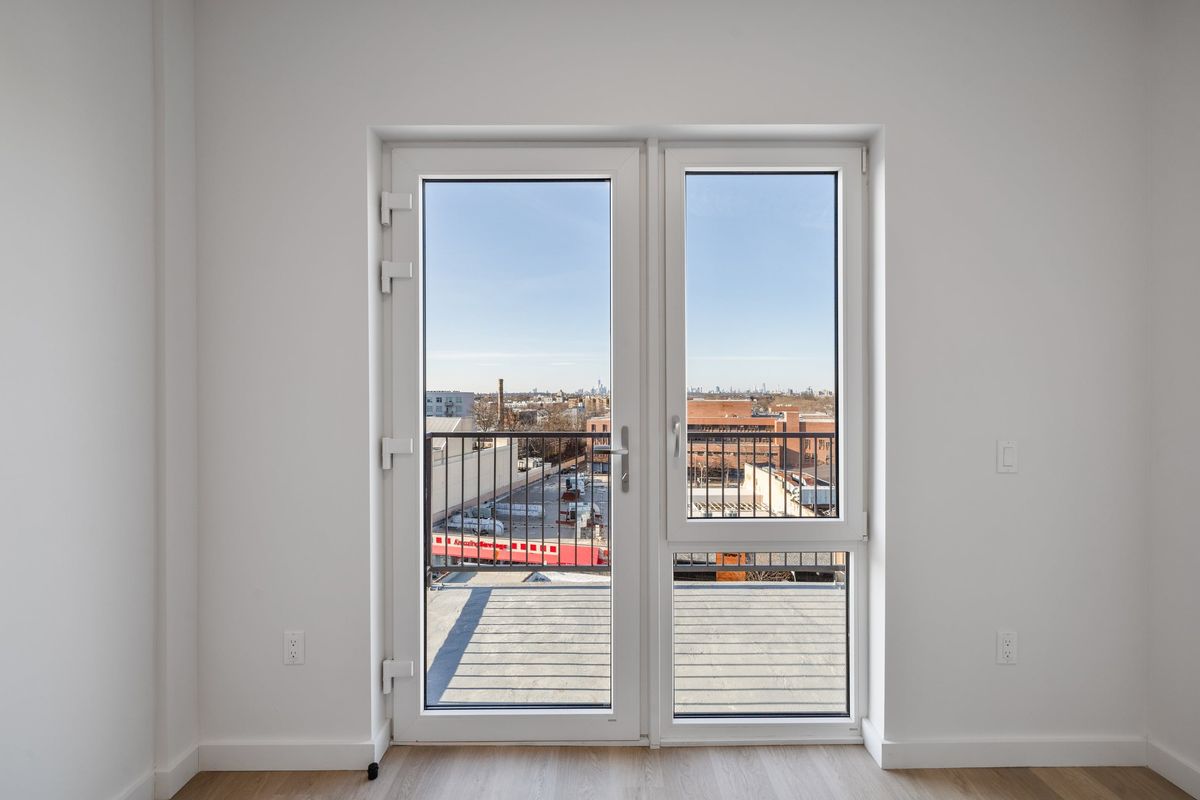 White terrace doors opening onto a terrace
